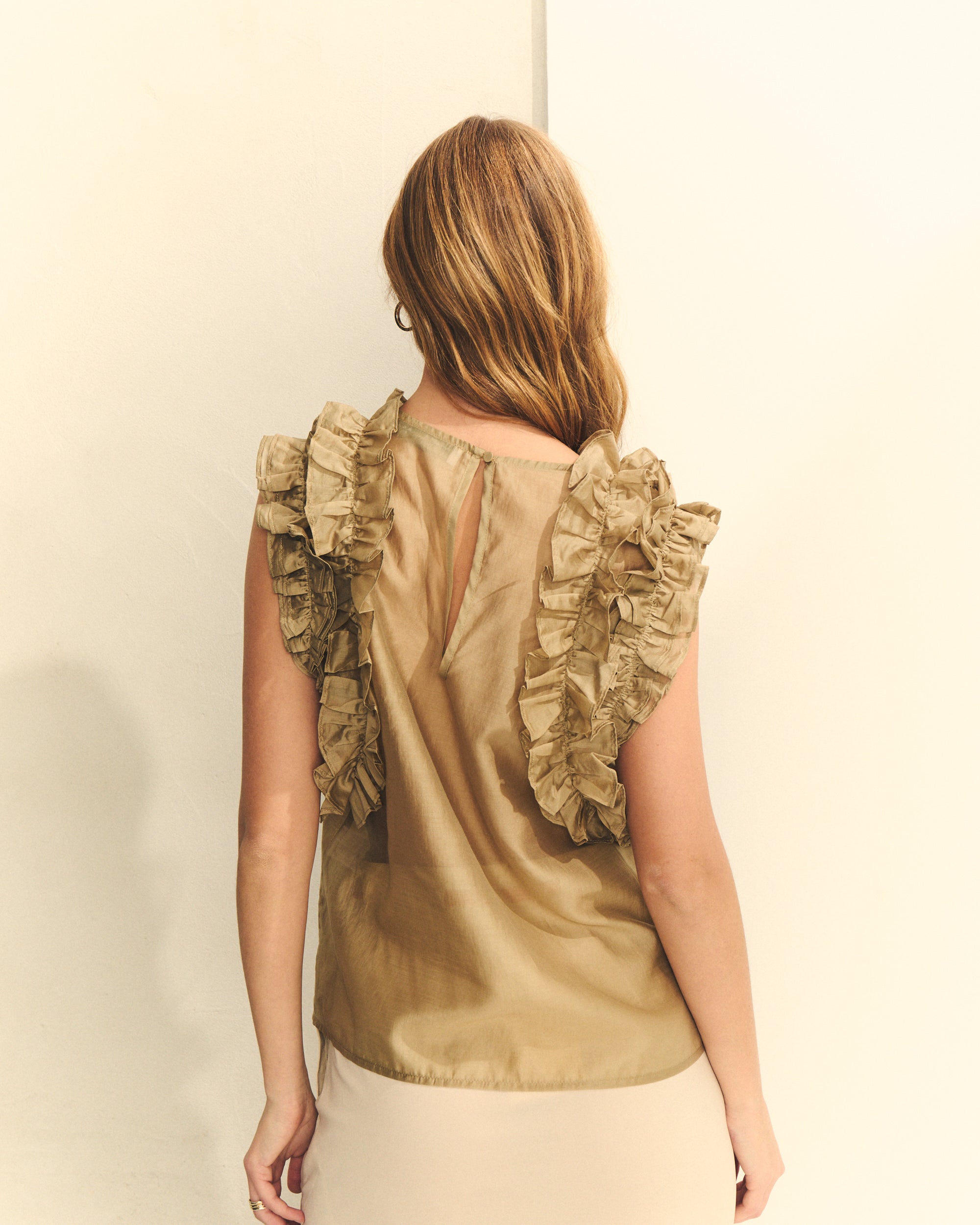 BLUSA TRANSPARENTE CON VOLANTES