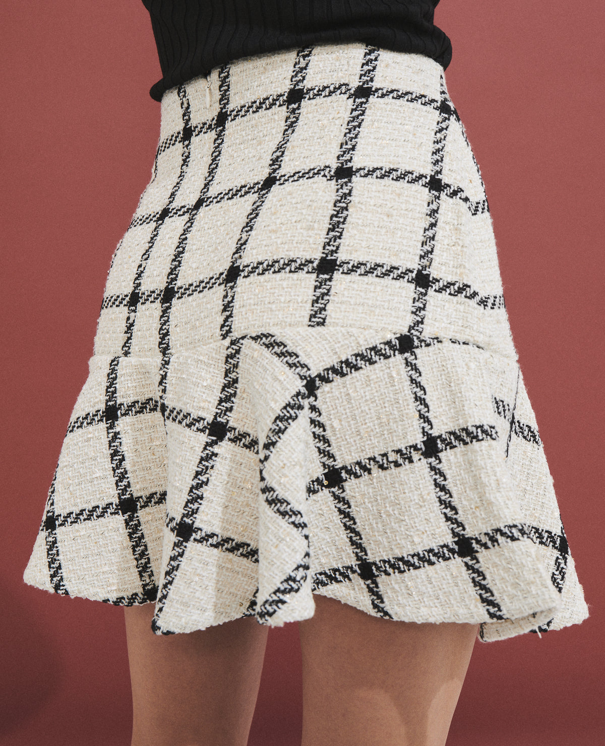 Falda corta con tejido de cuadros estilo tweed